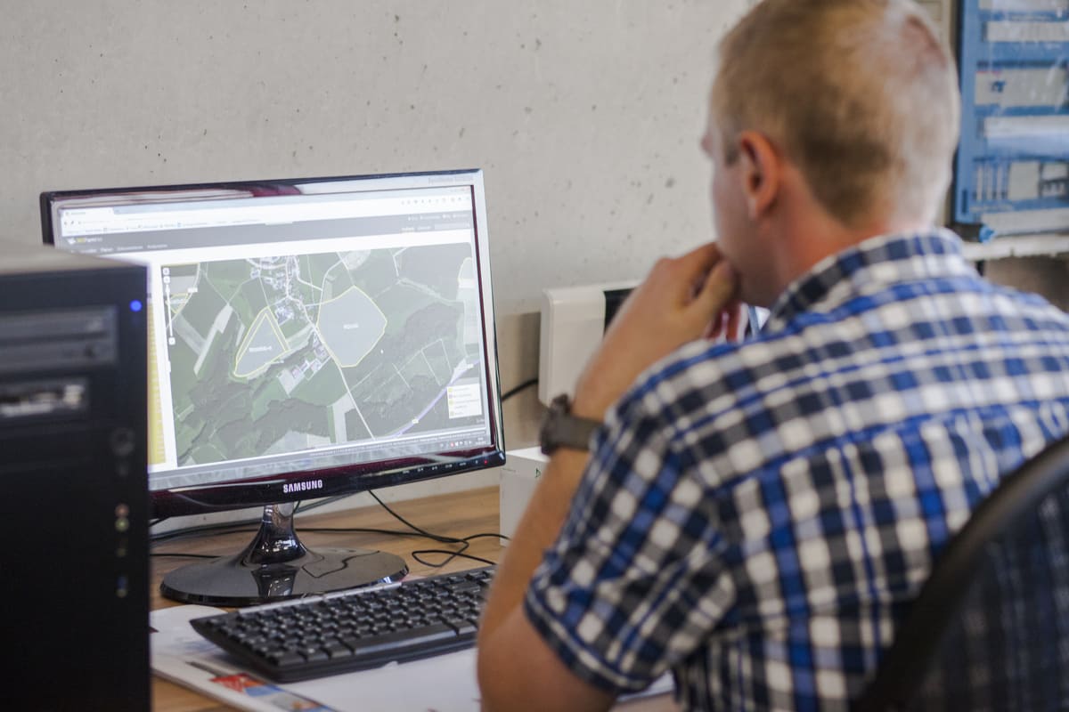 Farmer works with computer