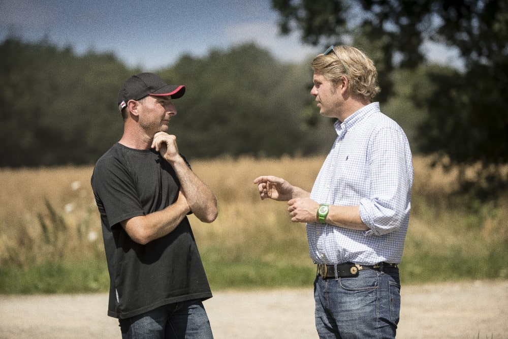 Farmer talking with a farm expert. Farmer talking with a farm expert.